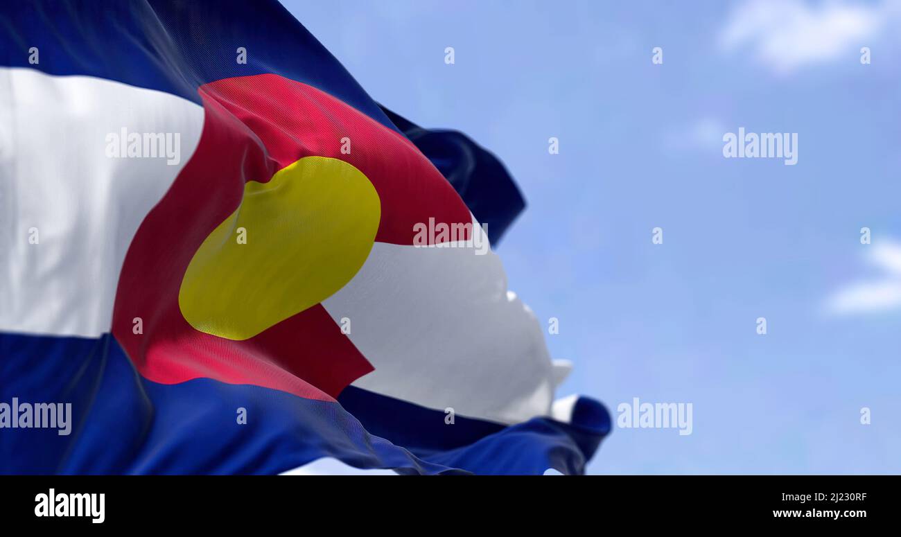 the flag of the US state of Colorado waving in the wind. Colorado was it admitted in 1876 as the 38th of the Union. Independence and unity Stock Photo