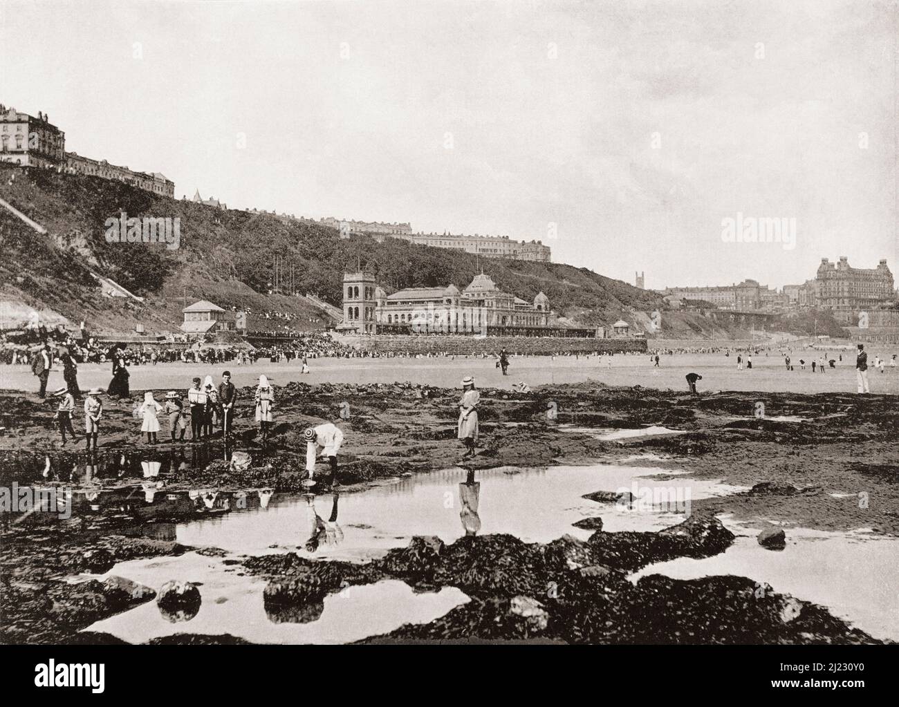 View from the rocks of South Bay and the Spa, Scarborough, North Yorkshire, England, seen here in the 19th century. From Around The Coast,  An Album of Pictures from Photographs of the Chief Seaside Places of Interest in Great Britain and Ireland published London, 1895, by George Newnes Limited. Stock Photo
