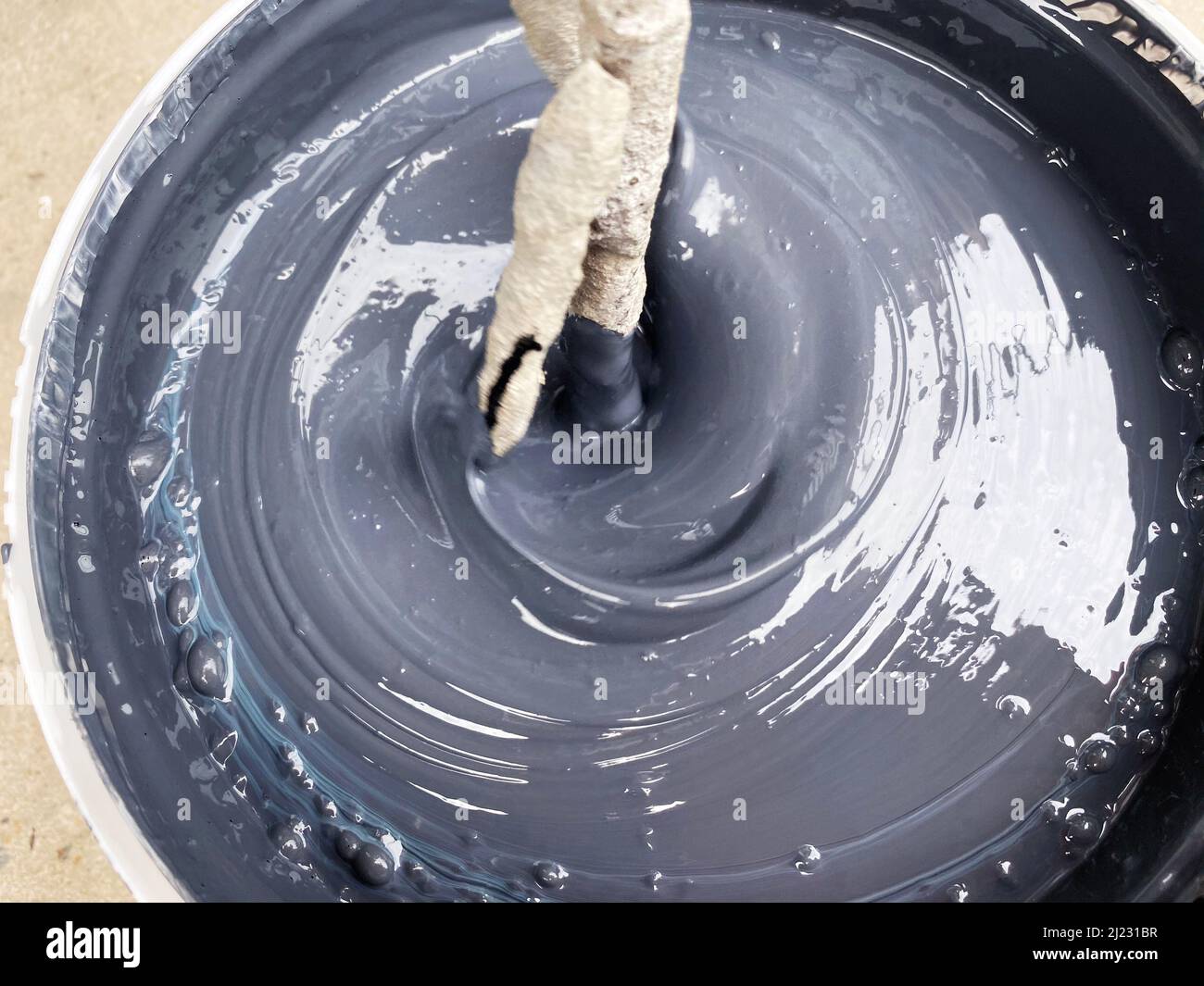 Building mixer for mixing paint. Mixing process Stock Photo Alamy