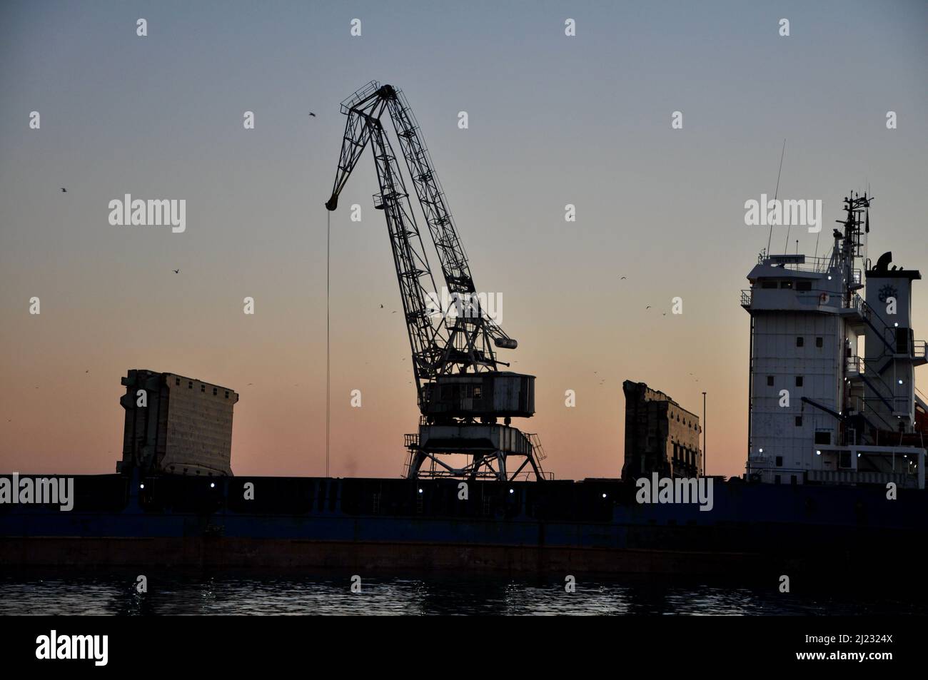 Old metallic crane details with sky as background in Rijeka harbour, Croatia Stock Photo