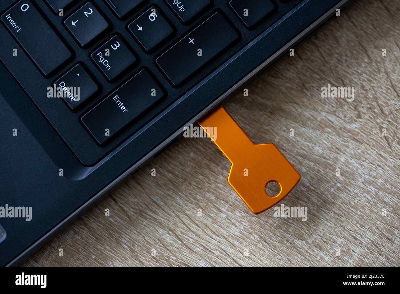 Close-up of a flash drive connected on a laptop Stock Photo