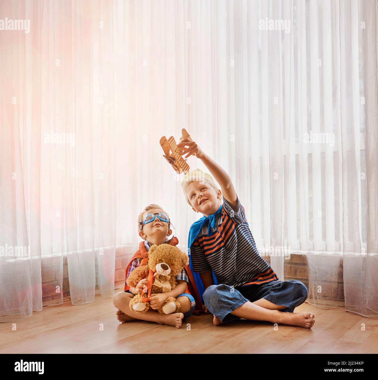 He knows just how to entertain his little brother. Shot of two little ...