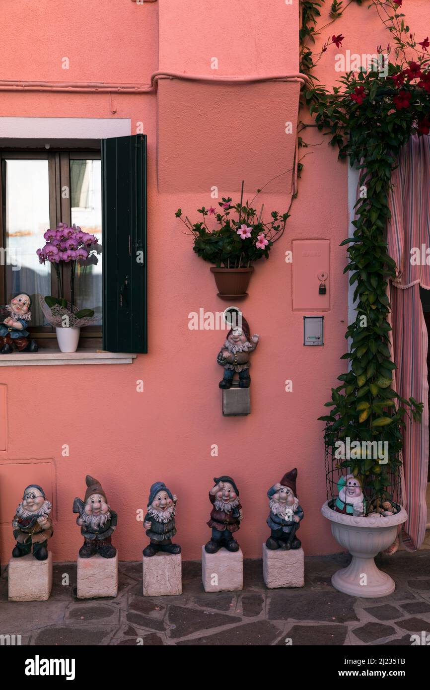 Italy,Venice,Burano, statues of the seven dwarfs outside a home Stock Photo
