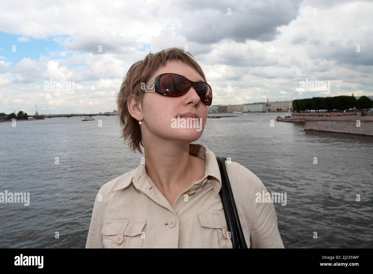 Portrait of the woman on the river background Stock Photo - Alamy