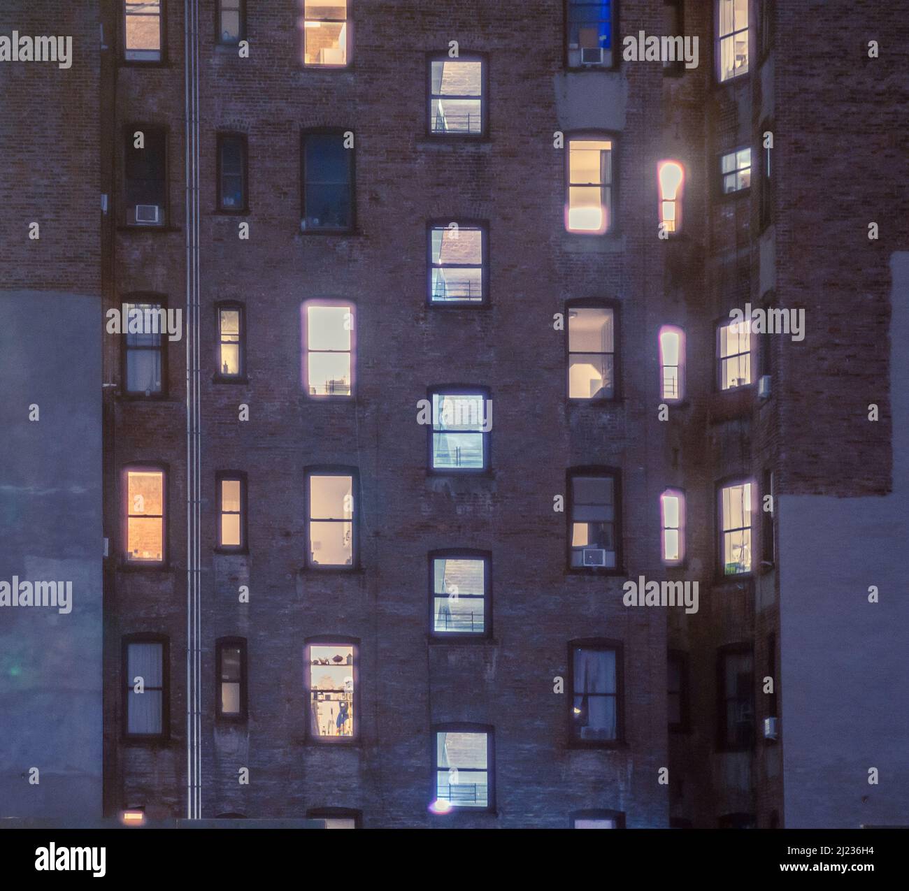 Illuminated apartment windows in Chelsea in New York on Friday, March 25, 2022. (© Richard B. Levine) Stock Photo