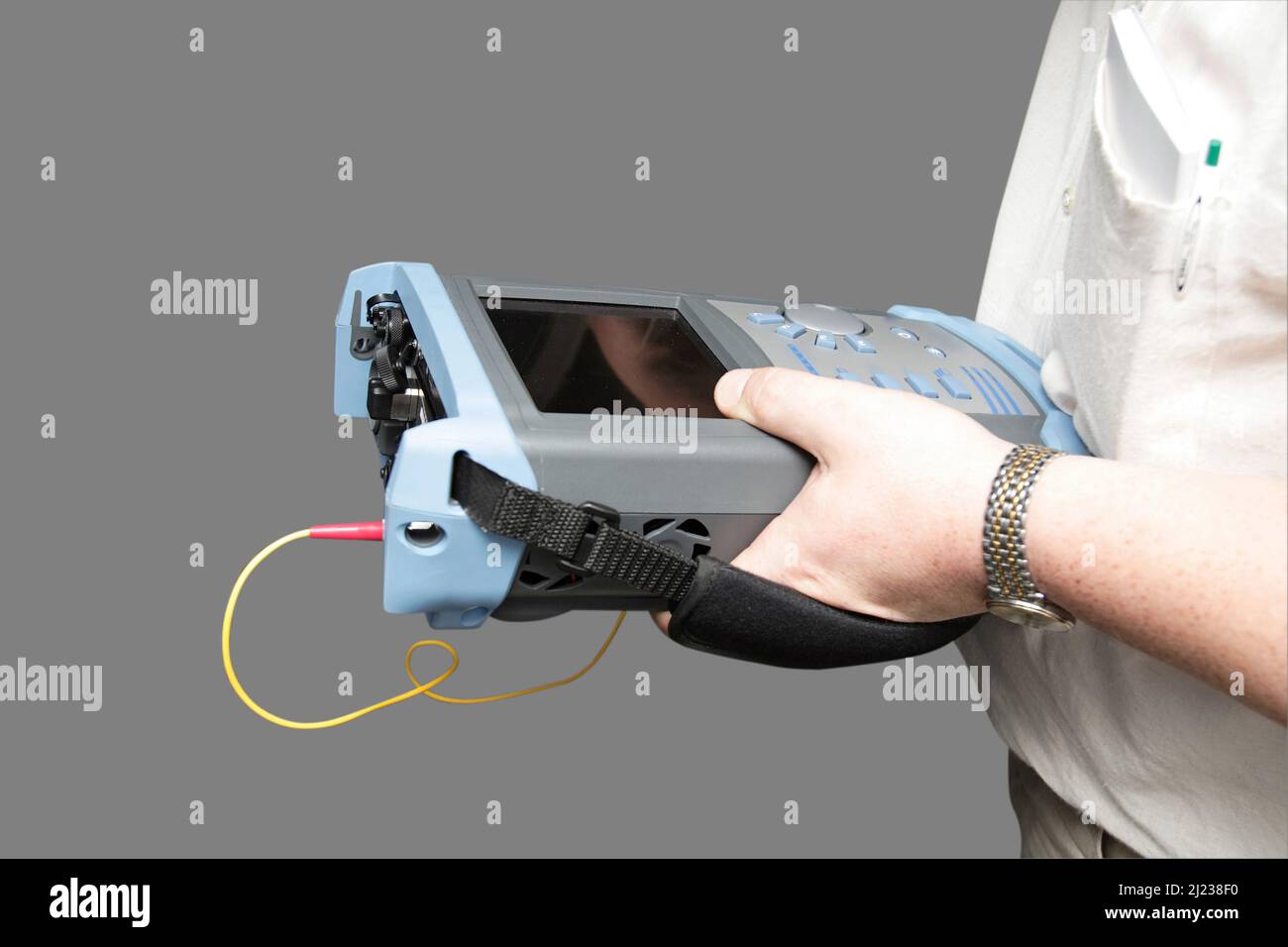 Engineer with reflectometer tests optical transmission line Stock Photo