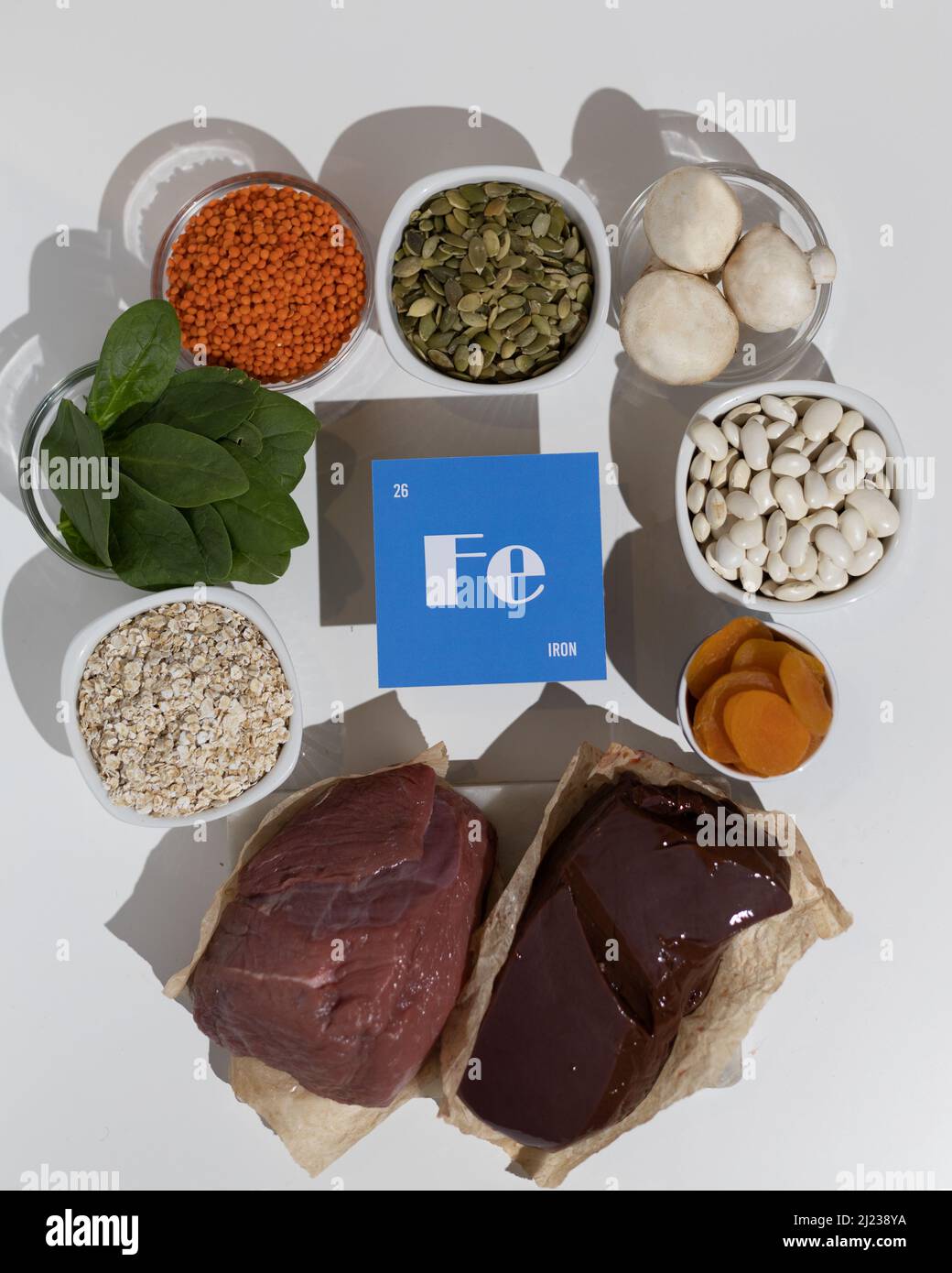 A group of healthy foods rich in iron. Healthy diet food. Cardboard sign with the inscription