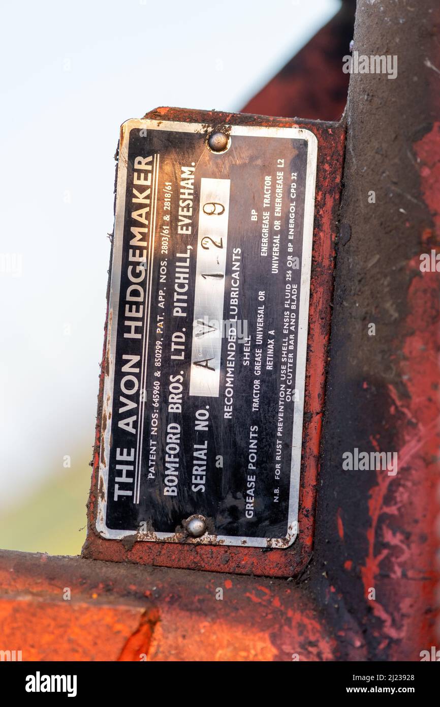 Close up of the metal tab showing the serial number on an old Bomford cutter bar hedgetrimmer Stock Photo