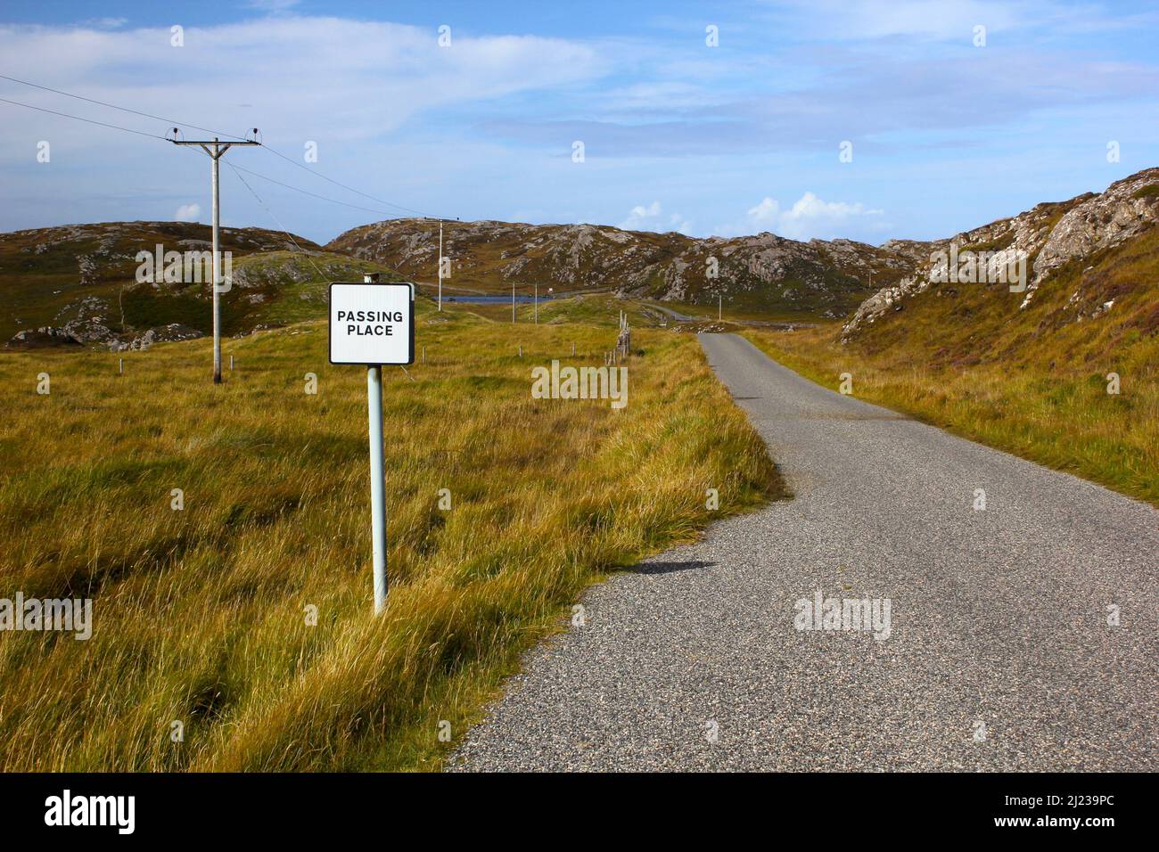 Passing place and sign on a narrow remote road in Scotland Stock Photo