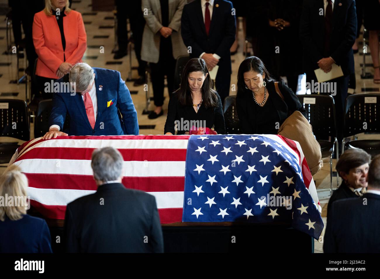 Washington, USA. 29th Mar, 2022. UNITED STATES - MARCH 29: From left, Rep. Rick Allen, R-Ga., Rep. Teresa Leger Fernandez, D-N.M., and Interior Secretary Deb Haaland pay their respects to Rep. Don Young, R-Alaska, at the casket as he lies in state in National Statuary Hall in the U.S. Capitol on Tuesday, March 29, 2022. (Photo by Bill Clark/Pool/Sipa USA) Credit: Sipa USA/Alamy Live News Stock Photo