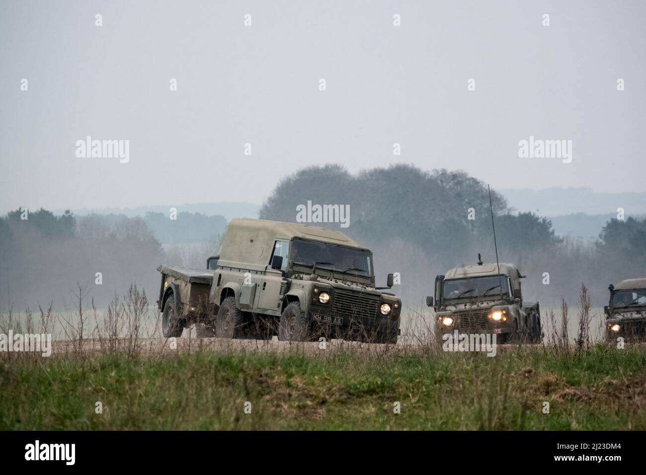 a small convoy British Army Land Rover Defender Wolf medium utility ...