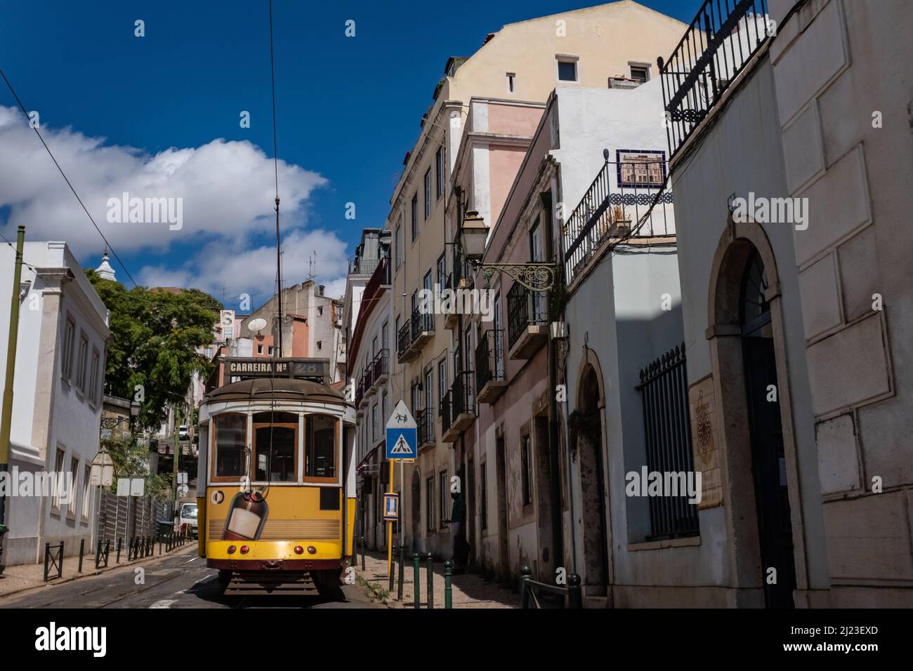 Old historical no. 28 tram Carreira on the street in Lisbon Portugal Stock Photo