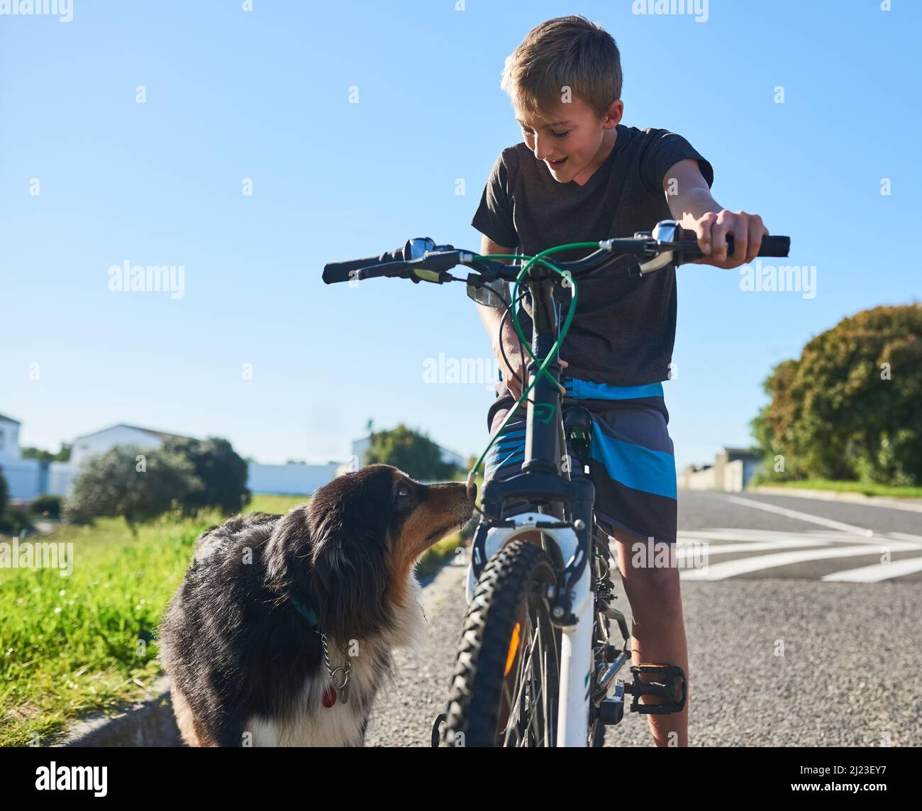 Cmon boy, its time to ride. Cropped shot of a young boy riding his bike outside. Stock Photo