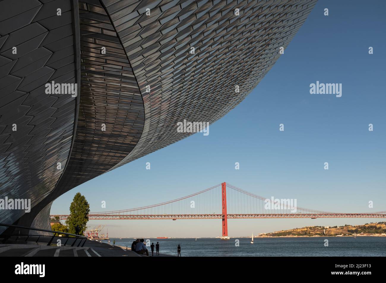 Tourists at Museum of Art Architecture and Technology with Tagus River, Lisbon, Portugal Stock Photo