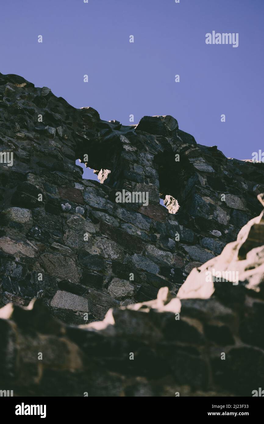 An old ruined tower facade in the blue sky background Stock Photo - Alamy