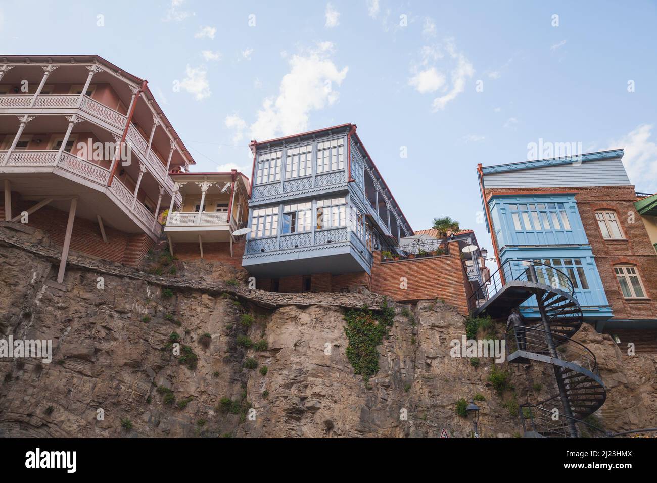 Old Tbilisi view, the Leghvtakhevi Canyon with old wooden houses on rocks. Georgia Stock Photo