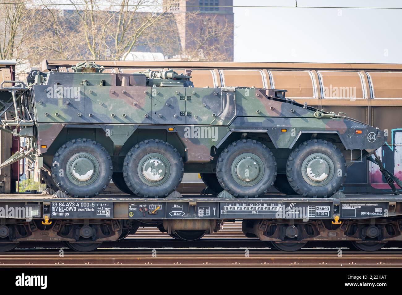 Venlo, Province Limburg, The Netherlands, 26.03.2022, Close up of military vehicle being transported by the rail freight transport Stock Photo