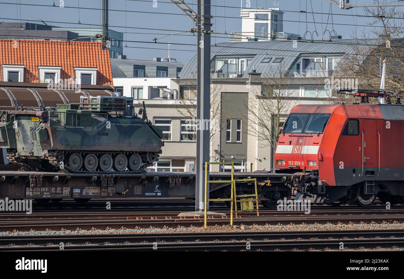 Venlo, Province Limburg, The Netherlands, 26.03.2022, Cargo train owned by german national railway company Deutsche Bahn (DB) transporting military ve Stock Photo
