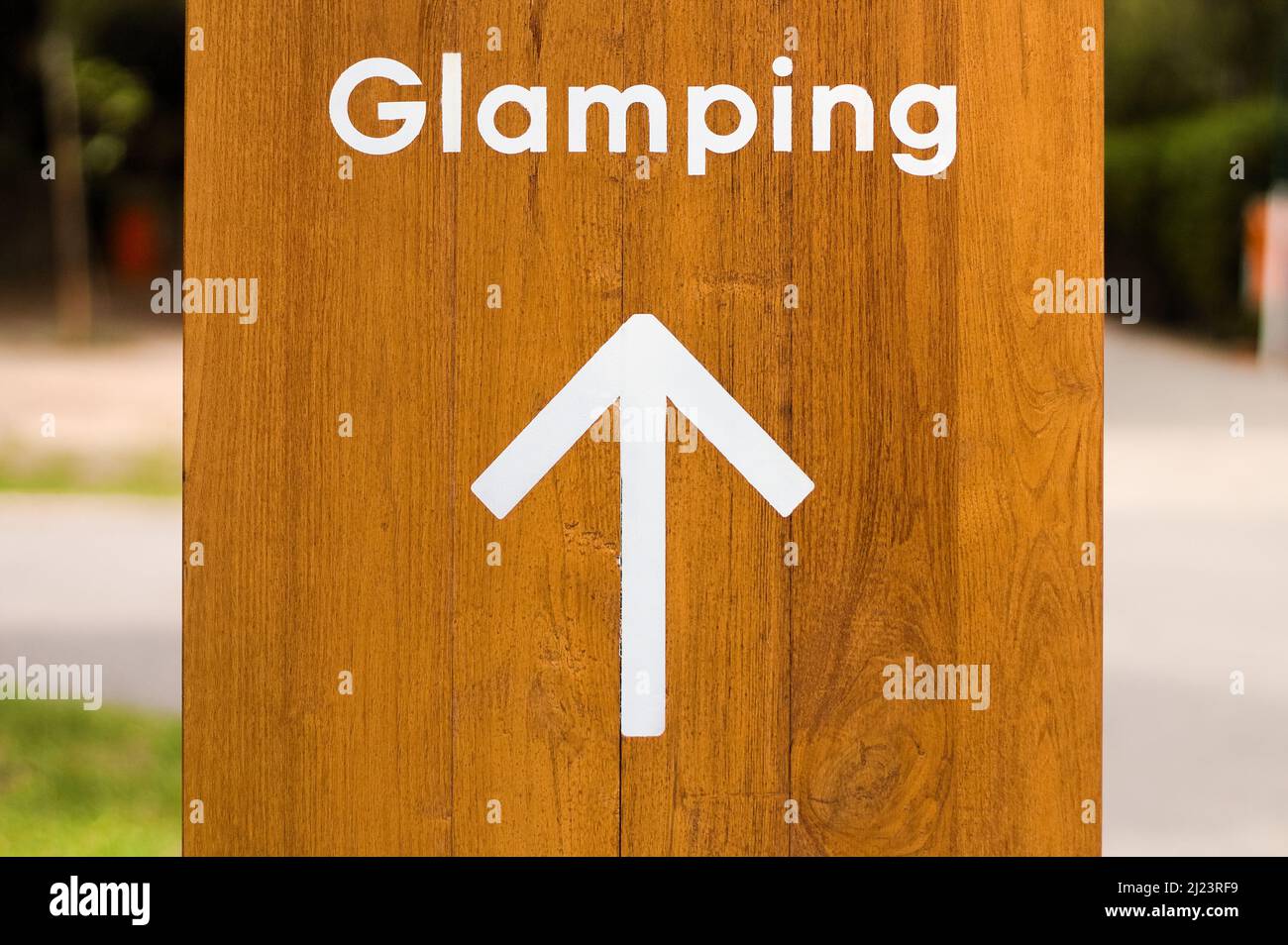 Glamping sign camp camping site ground facilities to luxury travel vacations holidays lodging Stock Photo