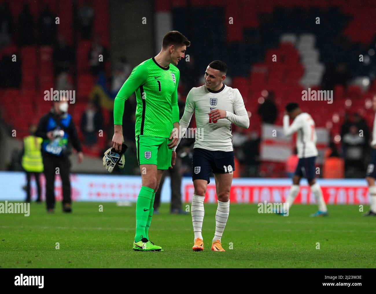 29th March 2022 ;  Wembley Stadium, London, England; International football friendly, England versus Ivory Coast; Goalkeeper Nick Pope of England talking to Phil Foden of England after full time Stock Photo