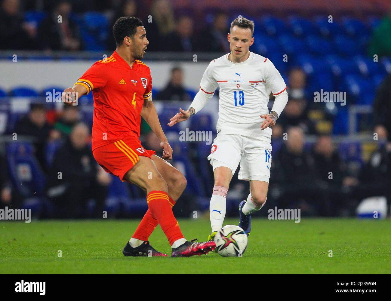 29th March 2022 ;  Cardiff City Stadium, Cardiff, Wales; International football friendly, Wales versus Czech Republic; Ben Cabango of Wales brings the ball forward while under pressure from Jan Sykora of Czech Republic Stock Photo