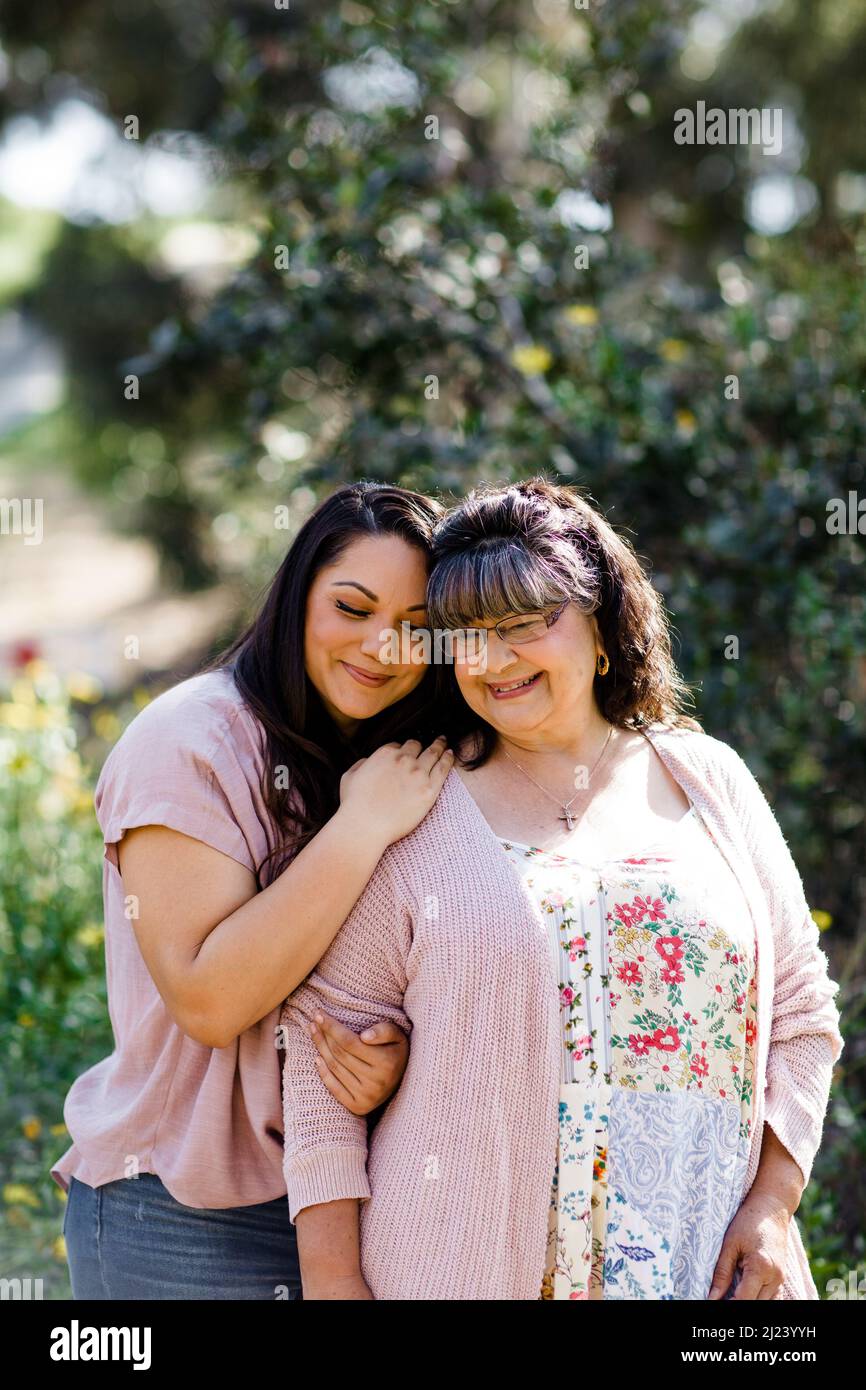 Mother & Daughter Embracing at Park in San Diego Stock Photo Alamy