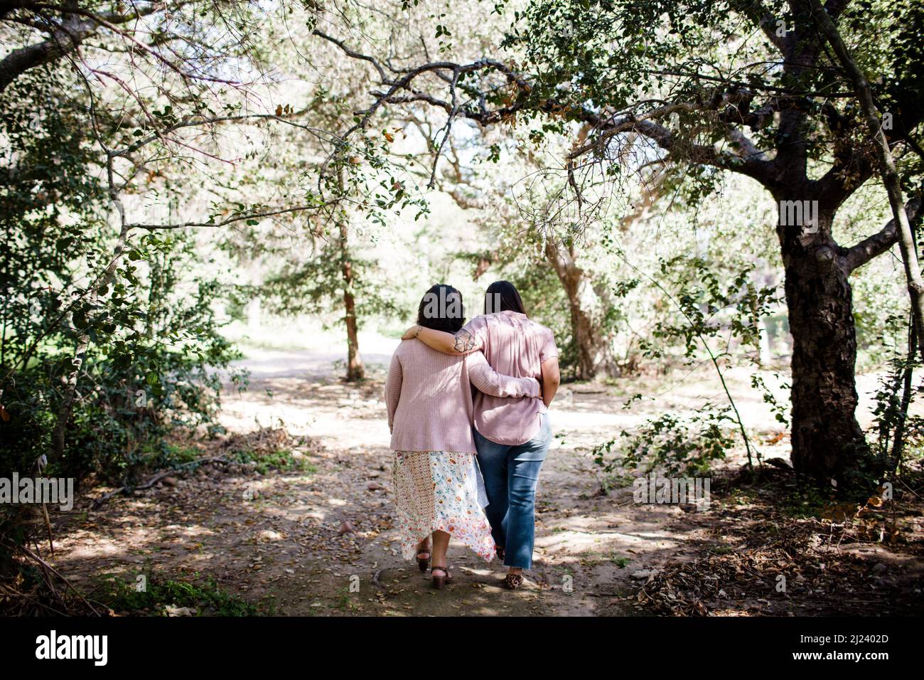 Mother & Daughter Walking Together on Trail in San Diego Stock Photo