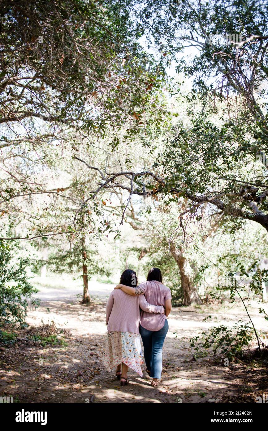 Mother & Daughter Walking Together on Trail in San Diego Stock Photo
