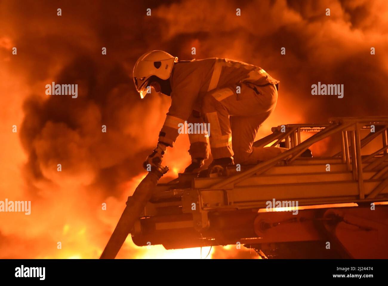 Rivne, Ukraine. 29th Mar, 2022. Rescuers work at a site of fuel storage facilities hit by cruise missiles, as Russia's attack on Ukraine continues, in Rivne region, Ukraine, on Tuesday on March 29, 2022. Credit: UPI/Alamy Live News Stock Photo