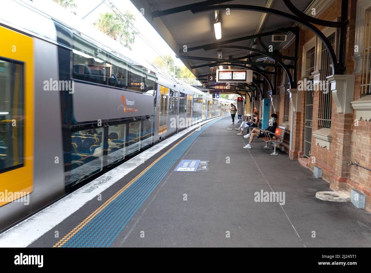 Commuters on the train station platform Stock Photo