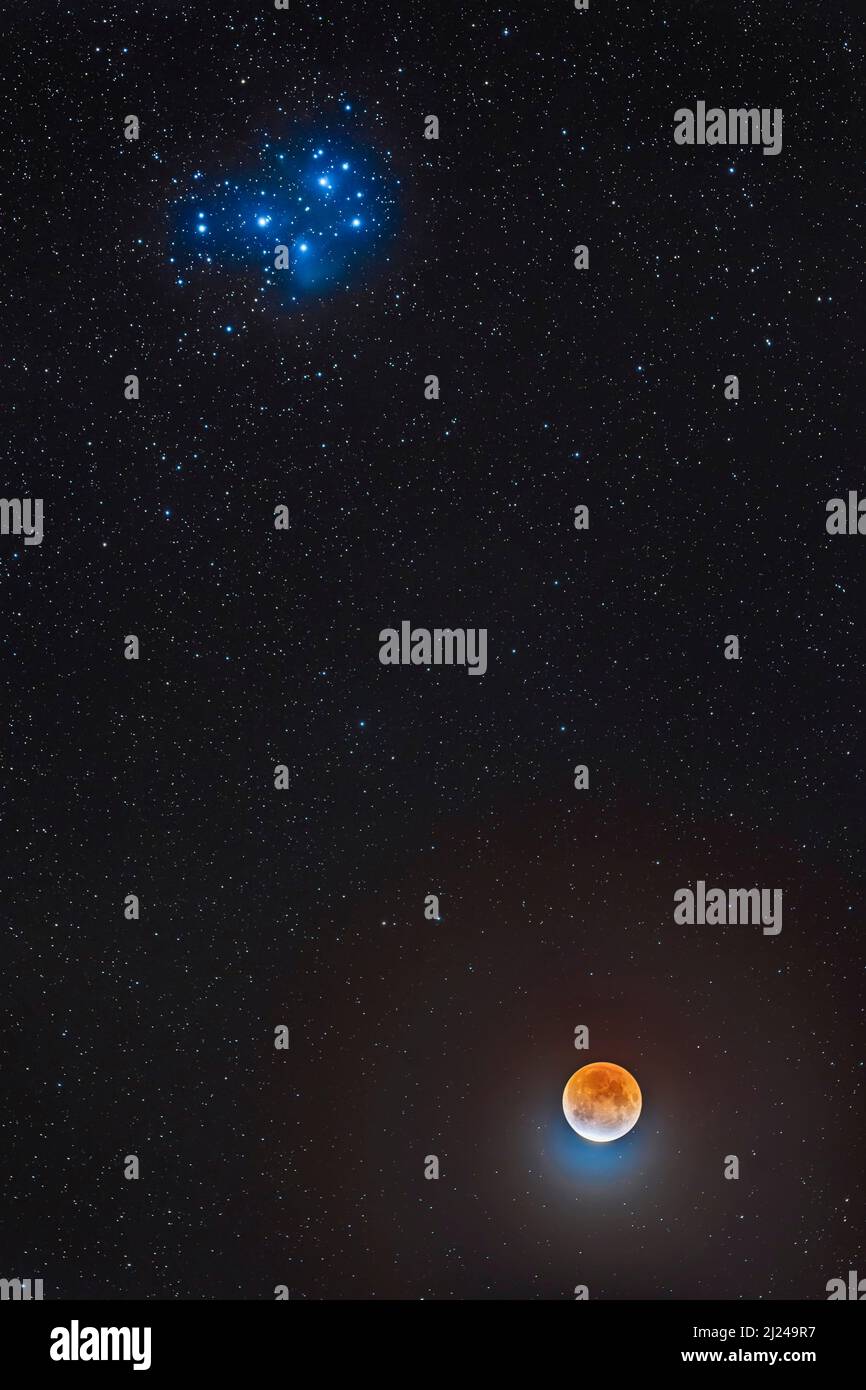 Moon below the Pleiades Stock Photo