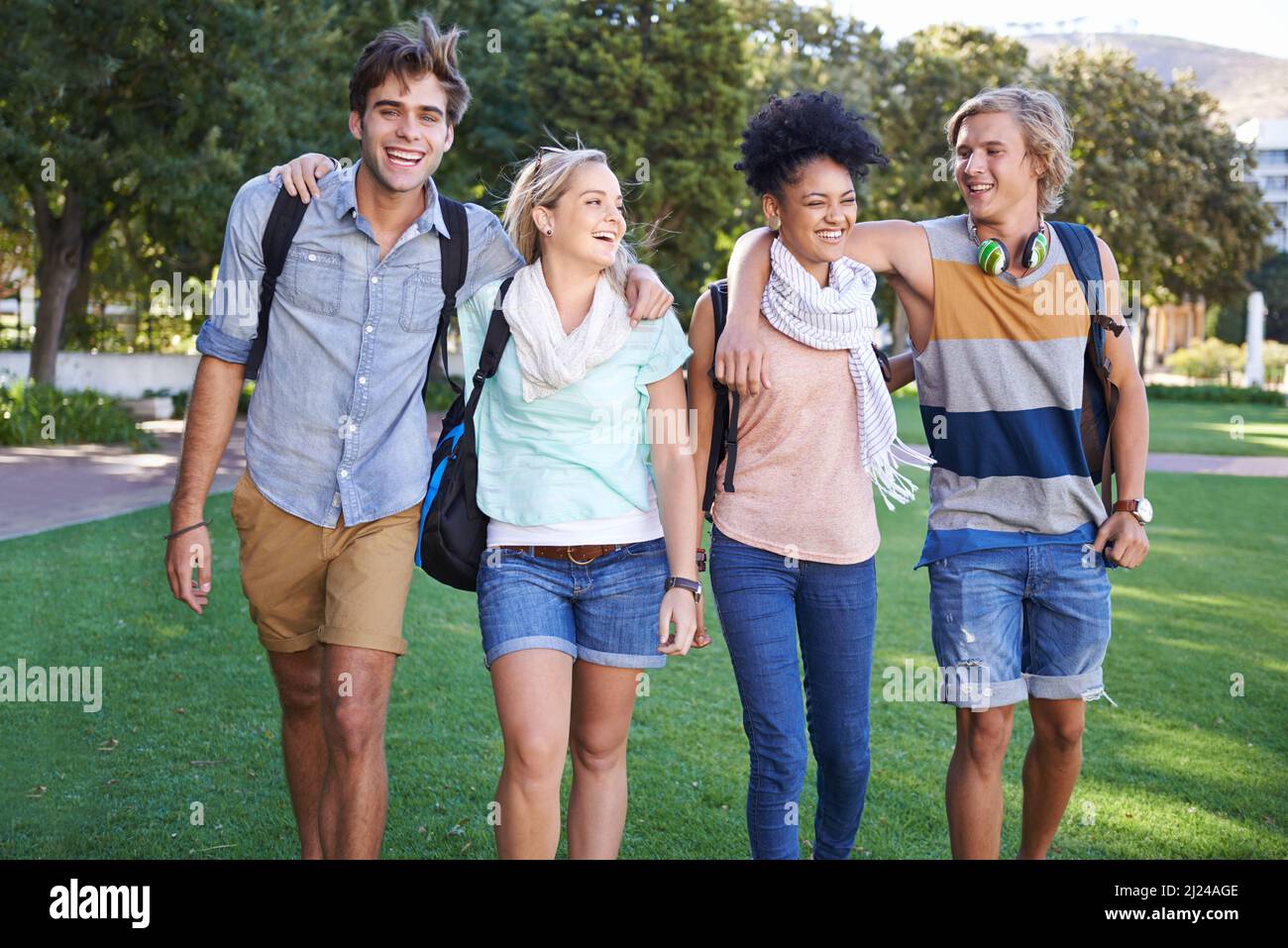 Loving the college years. A group of students taking a walking in a ...