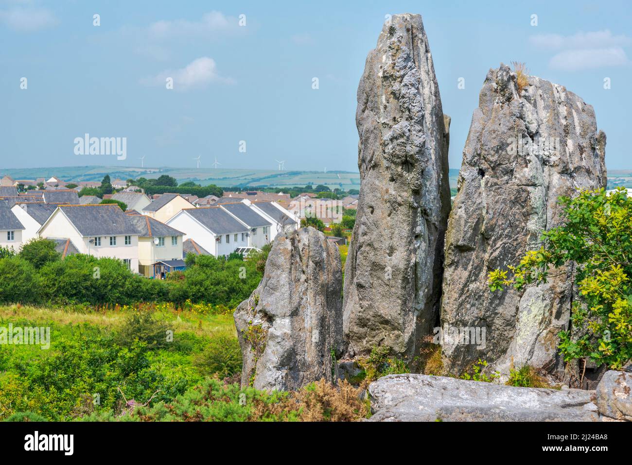 Residential houses,next to Roche Rock,a granite outcrop,a prominent granite landmark.Warm summer day in rural Cornwall. Stock Photo
