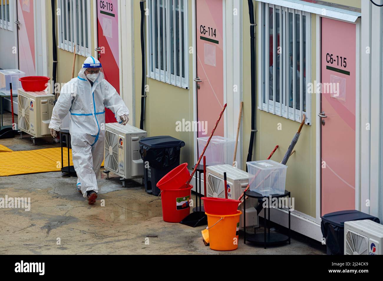 Hong Kong, China. 29th Mar, 2022. A worker wearing personal protective