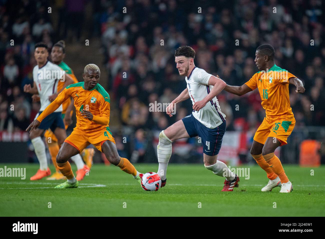 LONDON, ENGLAND - MARCH 29: Declan Rice of England and Jean Michael Seri and Max Gradel of Ivory Coast during the International Friendly match between England and Ivory Coast at Wembley Stadium on March 29, 2022 in London, England. (Photo by Sebastian Frej) Credit: Sebo47/Alamy Live News Stock Photo