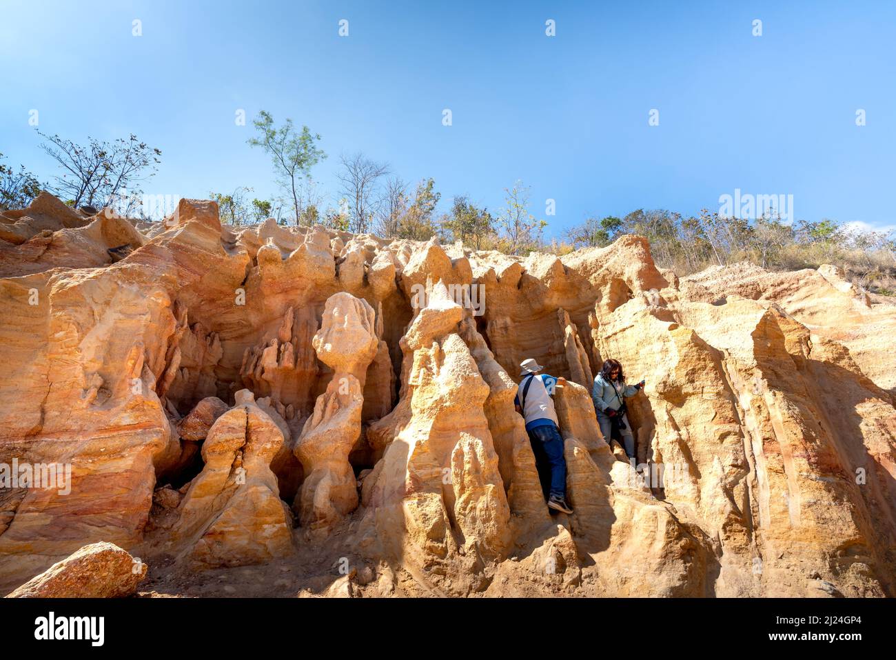 Chu Se district, Gia Lai province, Vietnam - March 5, 2022: Tourists visit a slope with mostly sandy soil, which due to natural soil erosion over the Stock Photo
