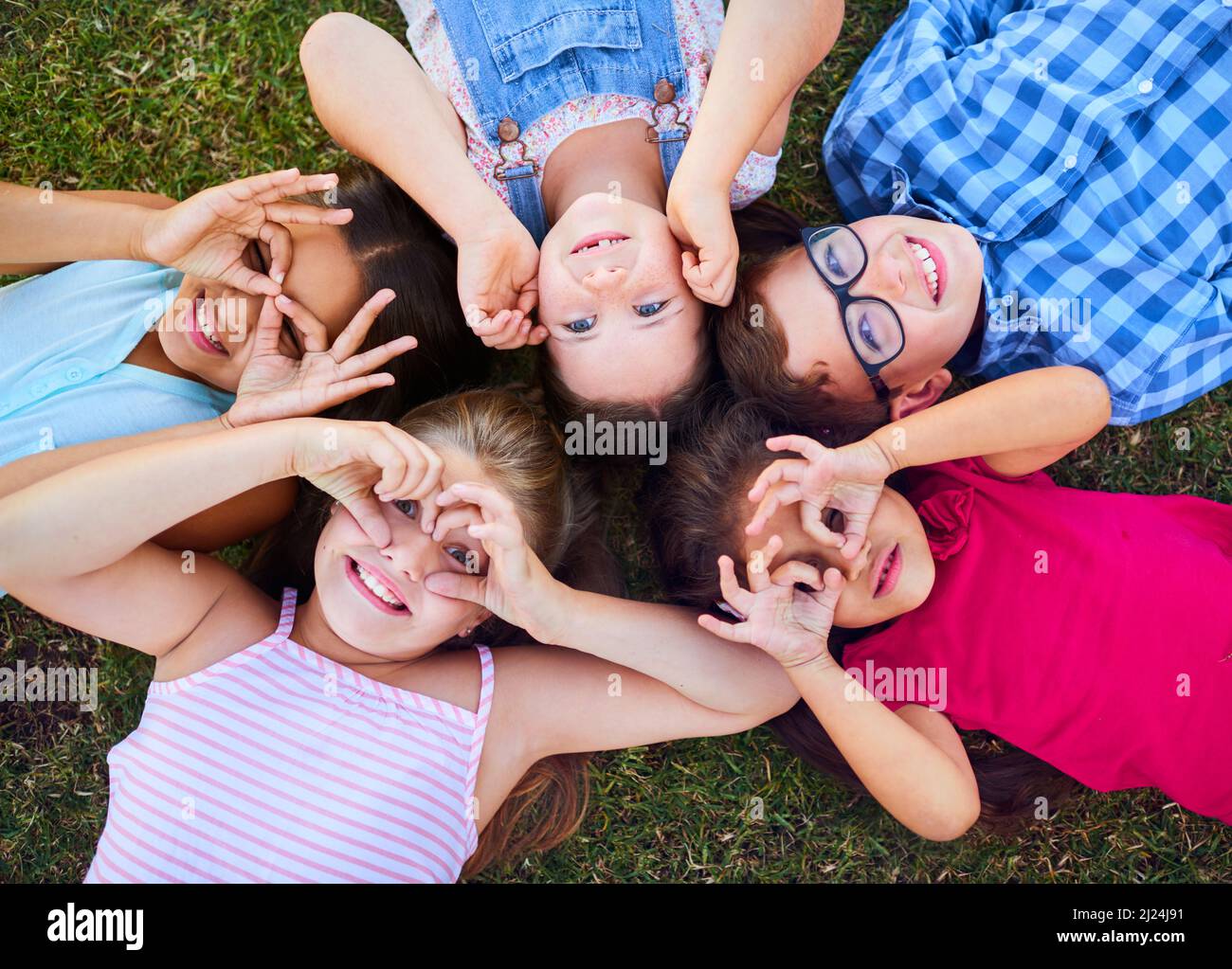 Children see magic because they look for it. Shot of a group of elementary school children together. Stock Photo
