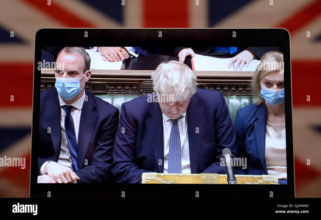 London, UK. 29th Mar, 2022. File photo taken on Jan. 12, 2022 shows British Prime Minister Boris Johnson (C) on a screen as he attends the weekly session of Prime Minister's Questions in London, Britain. British police said on March 29, 2022 that they would issue 20 fixed penalty notices (FPN) over breaches of coronavirus lockdown rules at gatherings in Prime Minister Boris Johnson's offices and residence on Downing Street. Credit: Li Ying/Xinhua/Alamy Live News Stock Photo