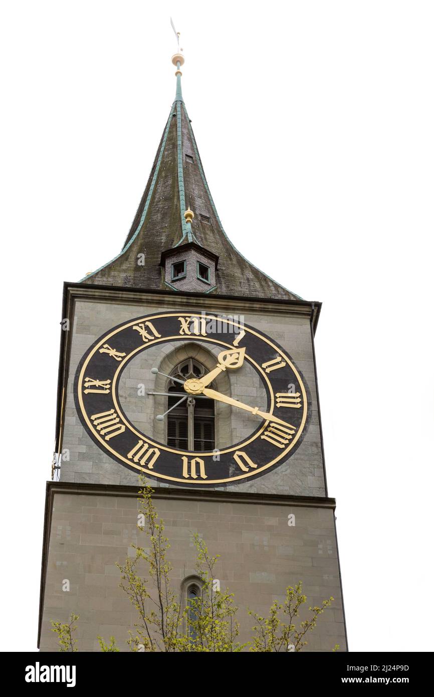steeple of St. Peter church in Zurich with large clock face on white background Stock Photo