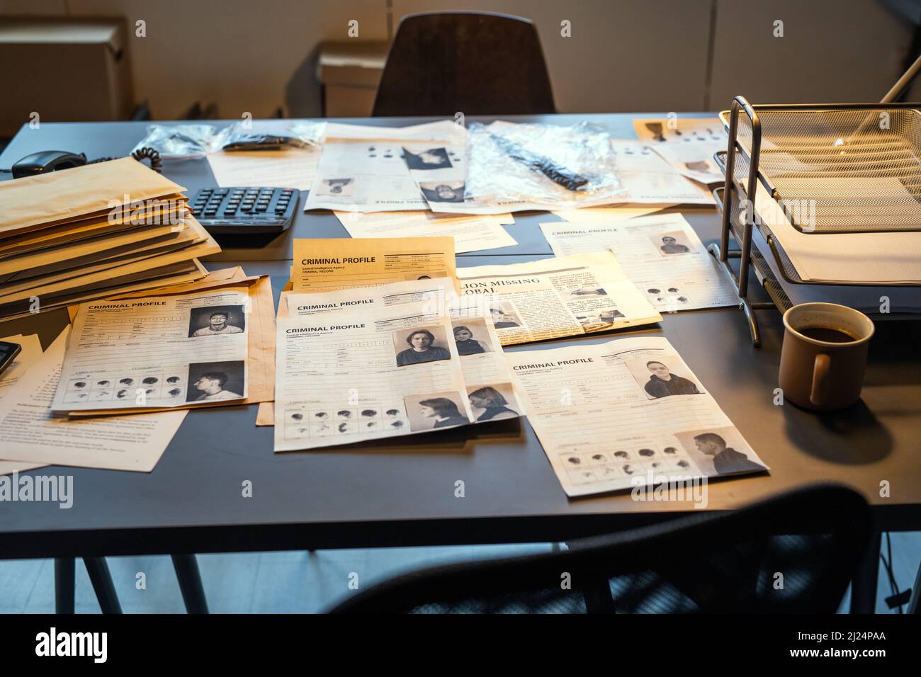Workplace of fbi agent with criminal profiles, evidences and clues