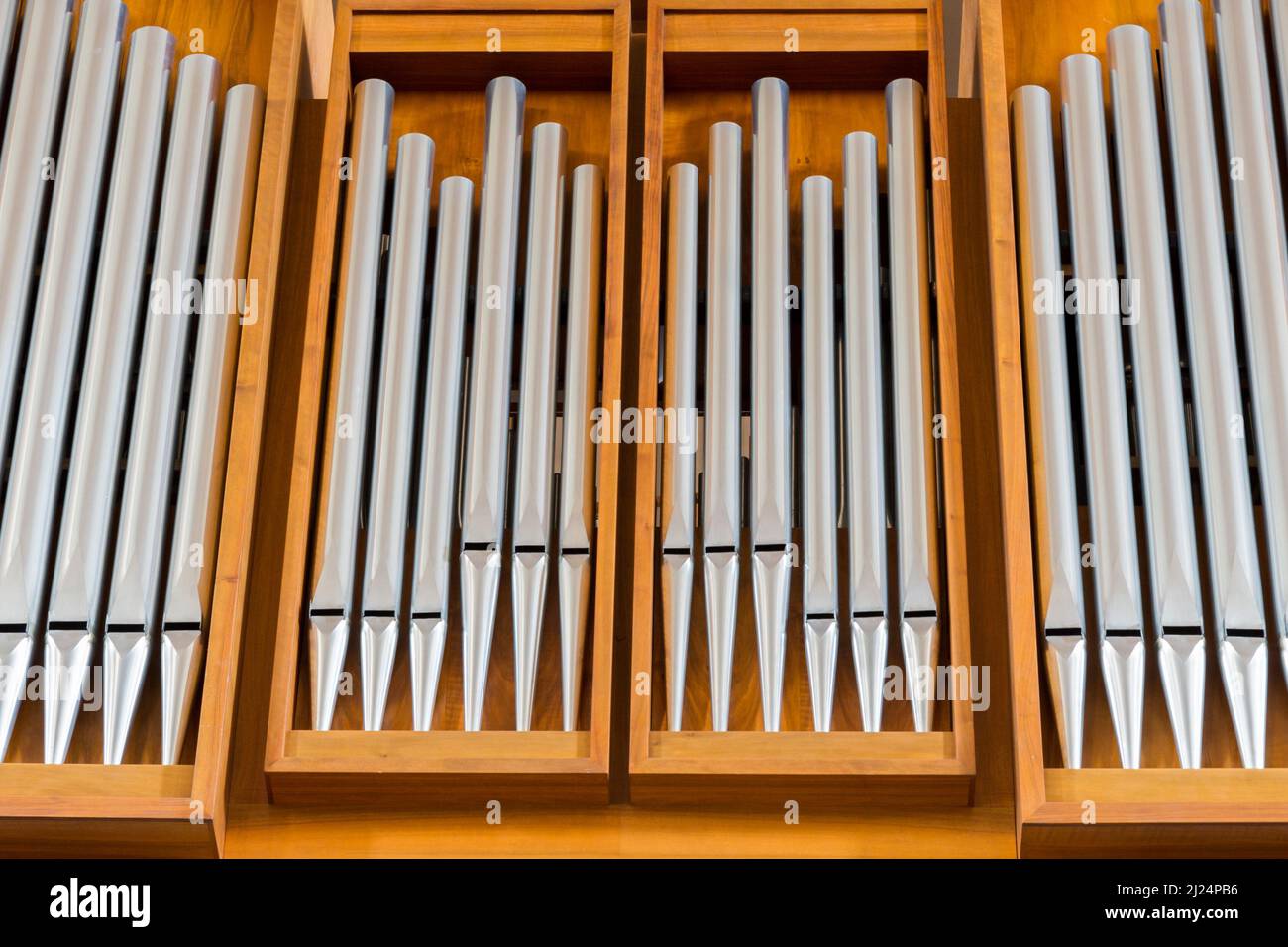 view on symmetric organ pipe  with wood of St. Peter church in Zurich Stock Photo