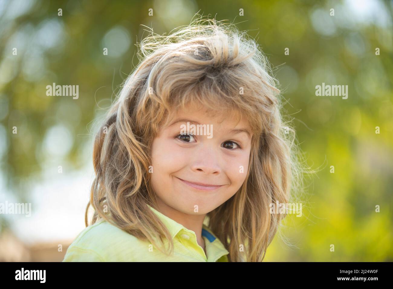 Face of cute smiling spring child. Kid emotions concept. Portrait of ...