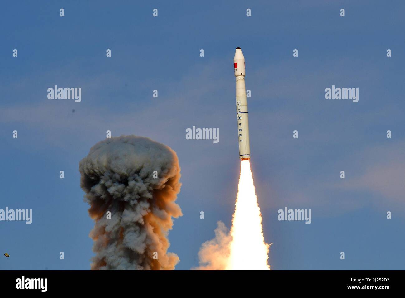 Jiuquan. 30th Mar, 2022. A Long March-11 carrier rocket carrying three satellites blasts off from the Jiuquan Satellite Launch Center in northwest China, March 30, 2022. China has successfully sent three satellites into space from the Jiuquan Satellite Launch Center in northwest China on Wednesday. The three satellites Tianping-2A, Tianping-2B and Tianping-2C will provide services such as atmospheric space environment survey and orbital prediction model correction. Credit: Wang Jiangbo/Xinhua/Alamy Live News Stock Photo