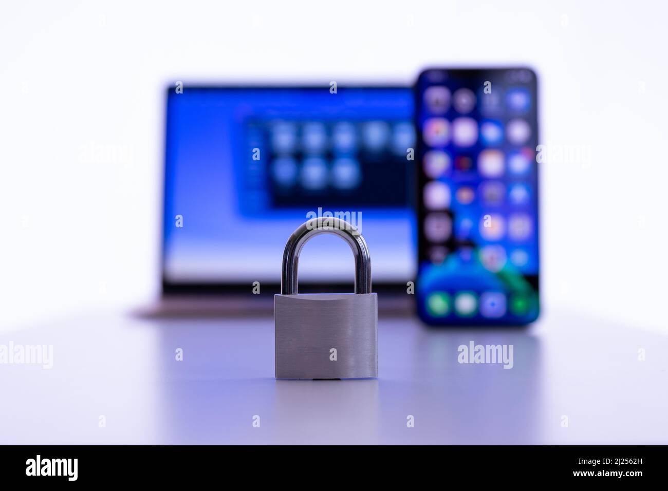 Privacy and data protection: Laptop and smartphone with locked padlock Stock Photo