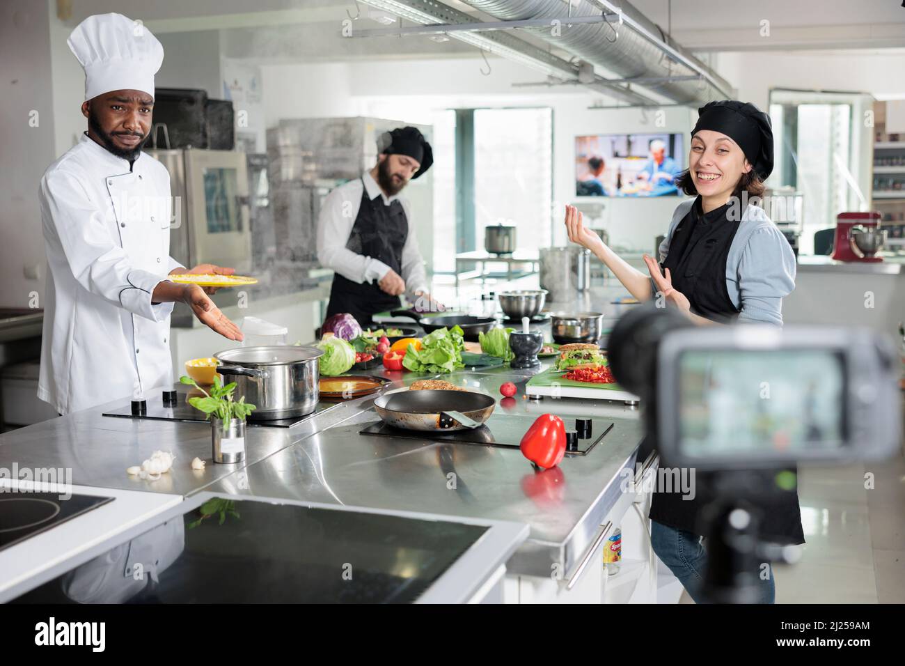 Food industry workers shooting video for television cooking show while