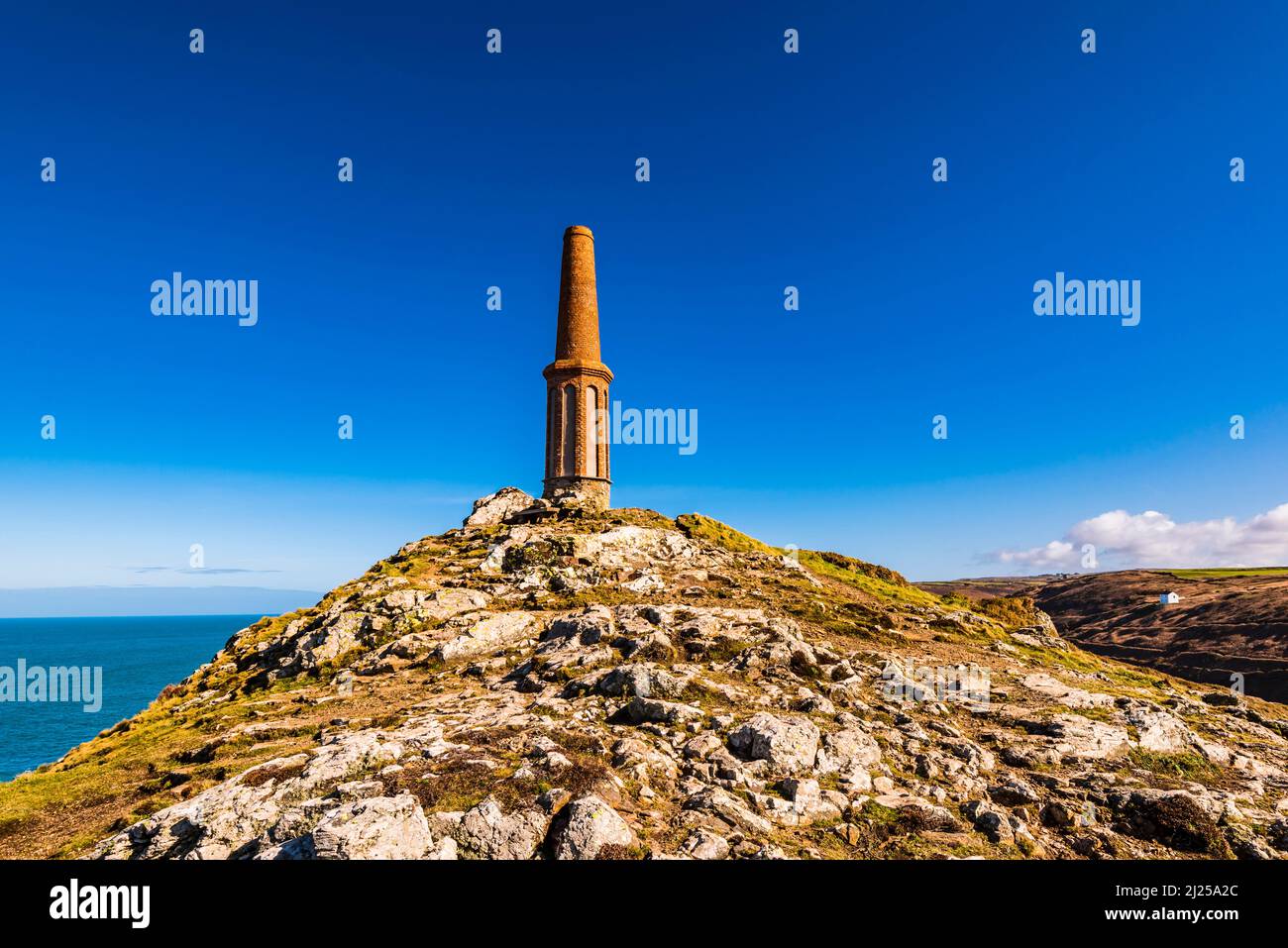 The Cape Cornwall Mine chimney and looking out to sea, from Cape Cornwall, near Land's End, Penzance, Cornwall, UK Stock Photo