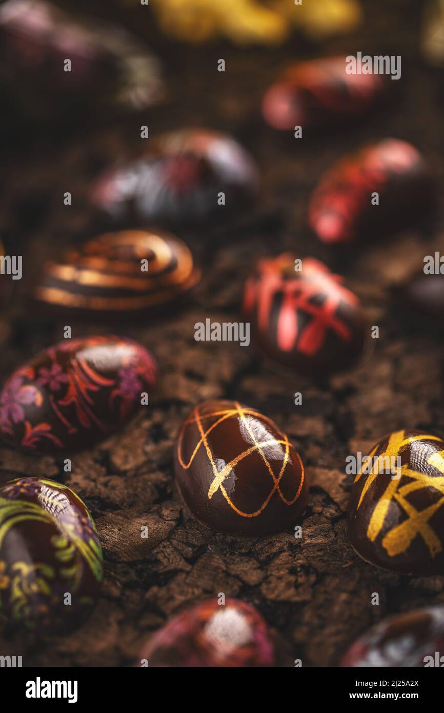 Easter chocolate eggs with different pattern, homemade craft chocolate for Easter holiday Stock Photo