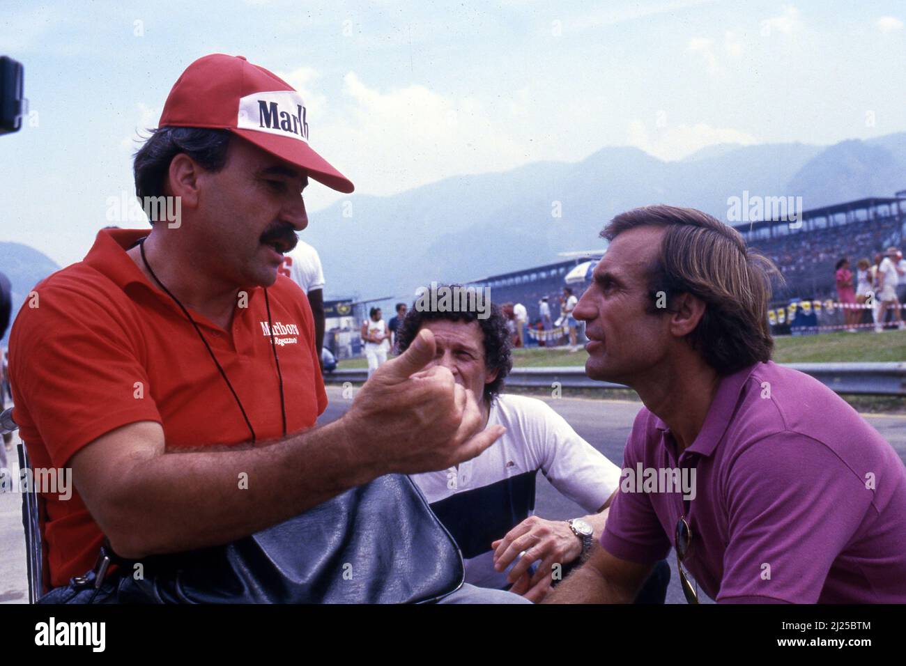 Ex f1 drive Clay Regazzoni (CH) talks with ex teammate Carlos Reutemann (ARG) Stock Photo