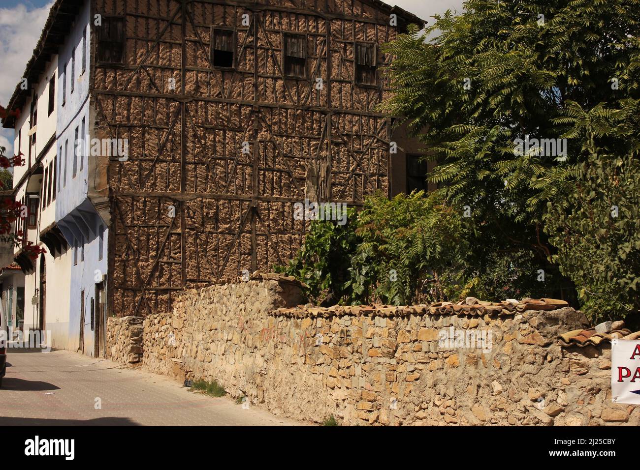 Old vintage masonry village house made of stones, bricks, wood