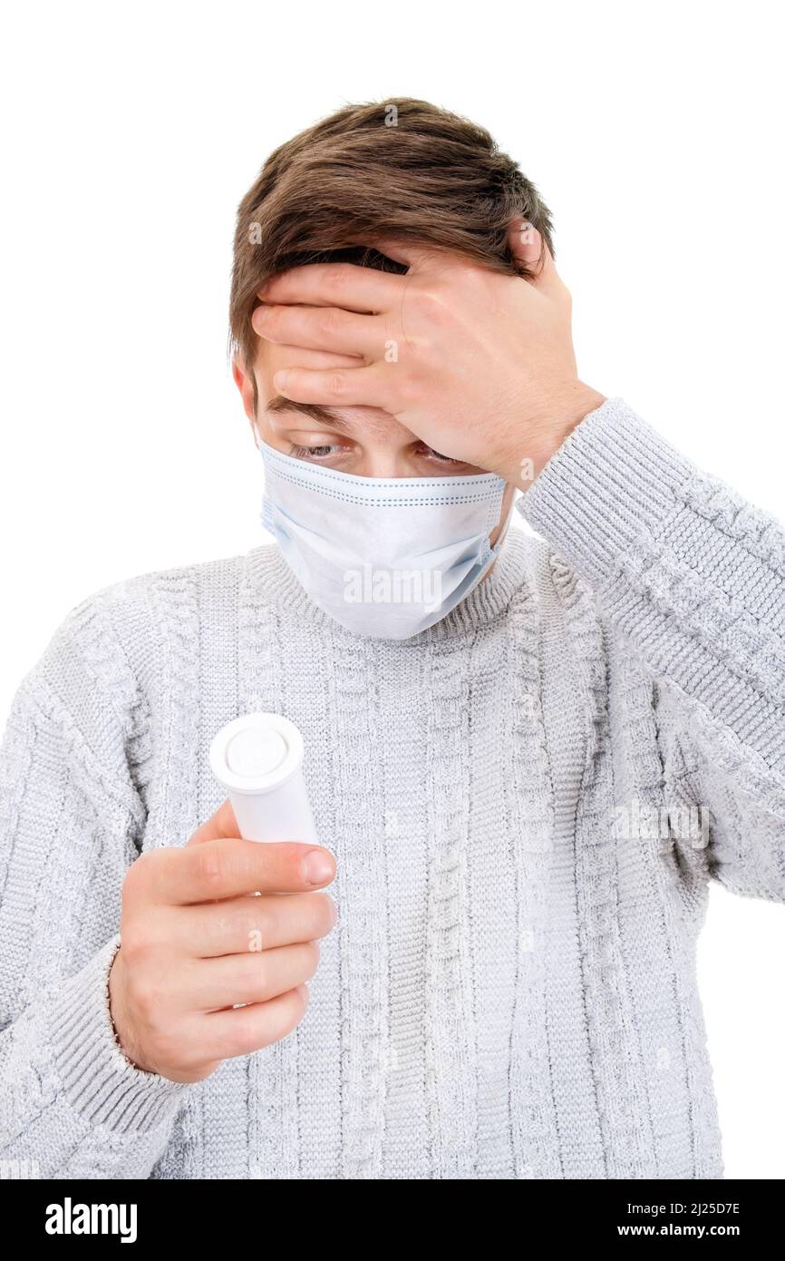 Young Man in the Flu Mask get a Side Effect from a Pills Isolated on the White Background Stock Photo